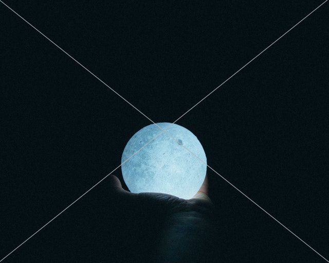 person holding moon lamp