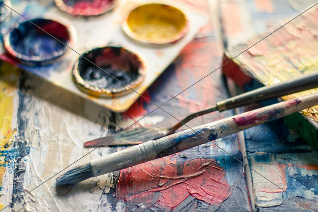 paintbrush near paint pallet