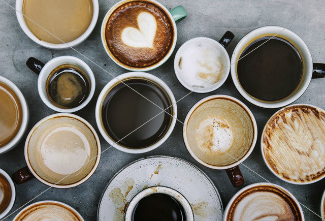 ceramic mugs filled with coffees