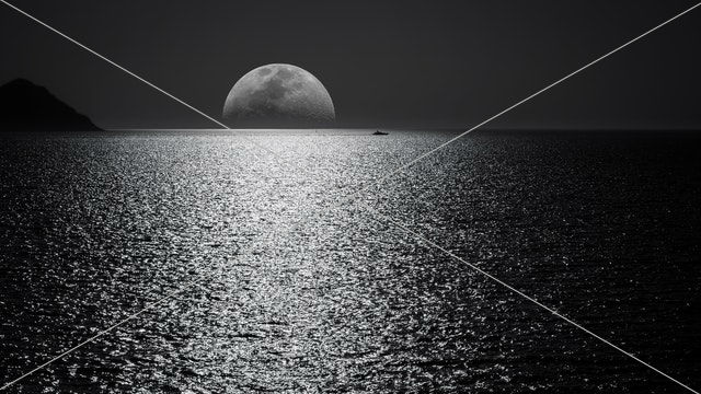 White and black moon with black skies